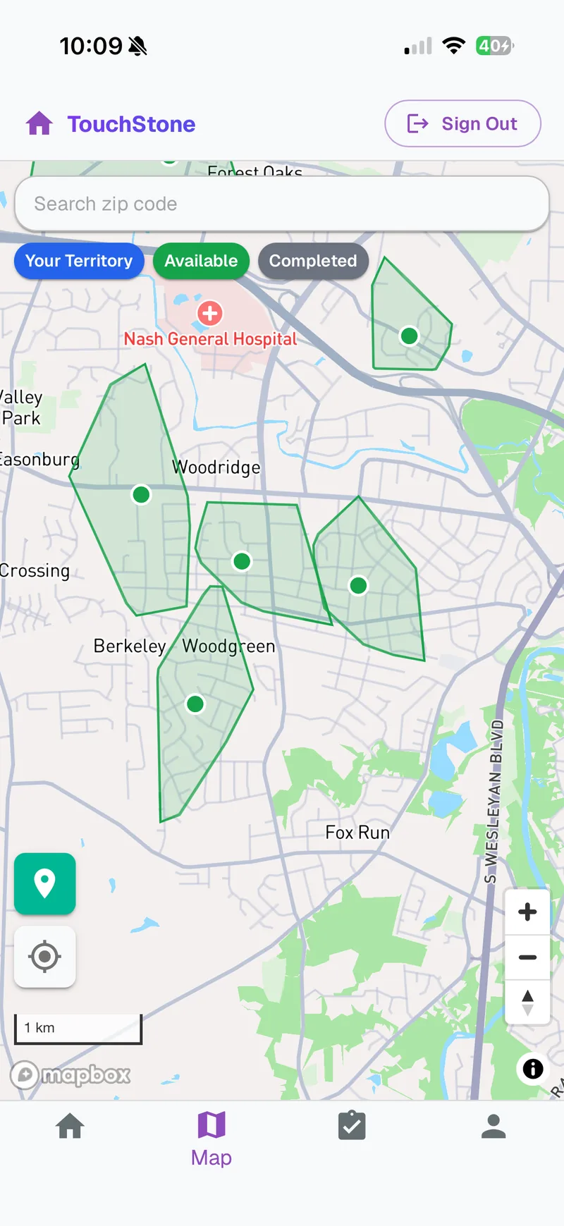 The canvasser app's live map with open territories drawn over a neighborhood, ready to claim